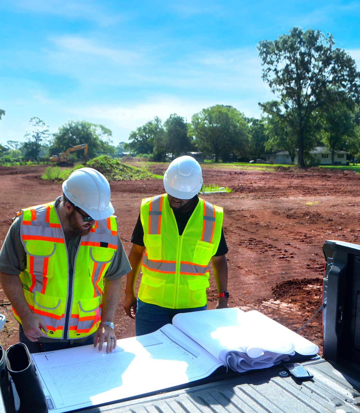 Two Ivaldi engineers reviewing site plans at the Hazel Green RV Park development near Huntsville, Alabama
